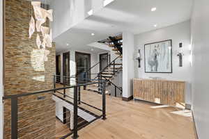 Stairs featuring wood-type flooring