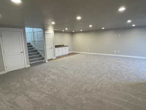 Basement with carpet flooring