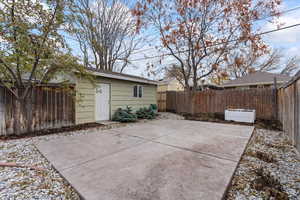 View of back patio and garage