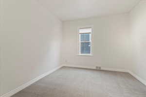 Larger main floor bedroom, centrally located in the house