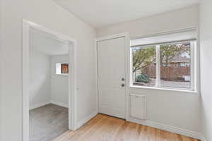 Back door with space for a desk or mudroom bench, and built in dog door