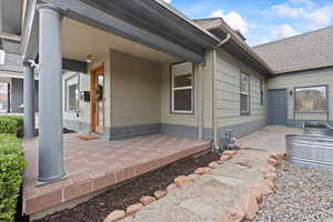 Exterior space with covered porch and secluded side patio