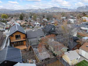 Aerial view of back of property with a mountain view