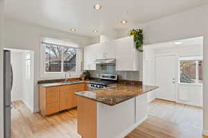 Kitchen featuring granite counters, and stainless steel appliance