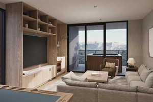 Living room with light hardwood / wood-style floors and a wall of windows