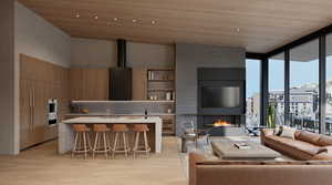 Living room featuring floor to ceiling windows, light hardwood / wood-style flooring, and wooden ceiling