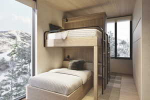 Bedroom with a mountain view, light hardwood / wood-style floors, and wood ceiling