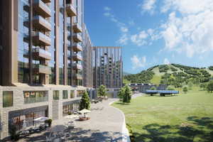 View of community featuring a mountain view and a yard