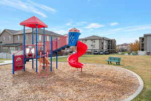 View of play area featuring a yard