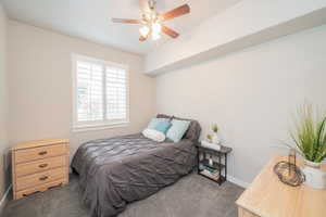 Bedroom featuring carpet flooring and ceiling fan