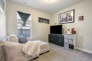 Sitting room with light colored carpet