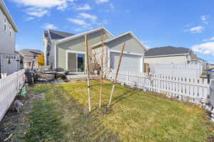 View of front of house with a front lawn and a garage