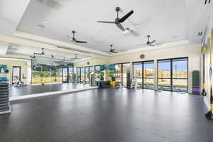 Workout area featuring a raised ceiling