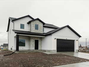 View of front of property with a garage