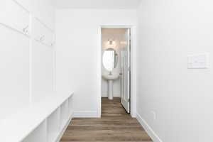 Mudroom with hardwood / wood-style flooring