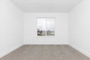 Unfurnished room with carpet floors