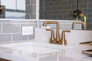 Room details with tasteful backsplash and sink