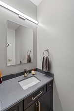 The main floor guest bath is upgraded and classy with 3cm Quartz countertops and an upgraded toilet.