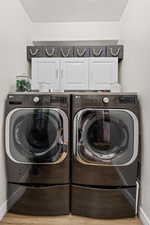 Fit your extra sized washer and dryer in this well placed laundry room.