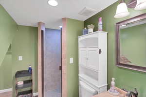 Bathroom featuring sink, toilet, and walk in shower