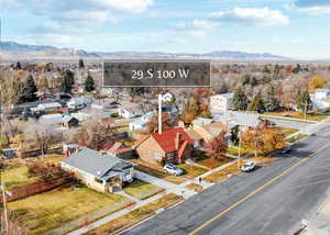 Birds eye view of property with a mountain view