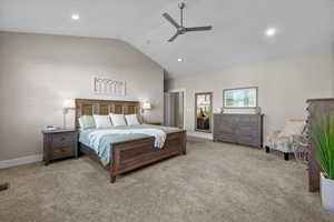 Carpeted bedroom with high vaulted ceiling and ceiling fan