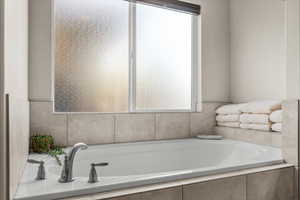 Bathroom with a relaxing tiled tub