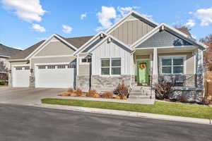 Craftsman-style home featuring a garage