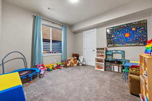 Playroom with carpet flooring