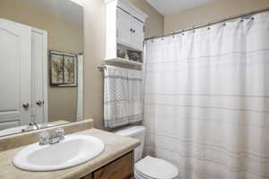 Bathroom featuring vanity and toilet