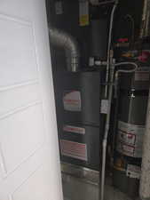 Utilities featuring gas water heater and heating unit