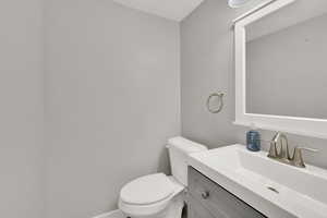 Bathroom with toilet and vanity