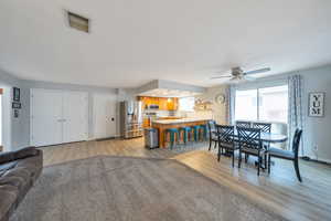 Dining area with light  wood-style floors