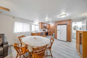 Dining room featuring lighwood-style floors