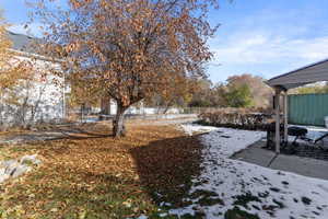 View of yard covered in snow