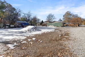 View of yard covered in snow