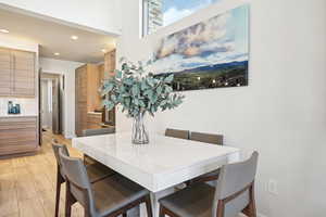 Dining room with light hardwood / wood-style flooring