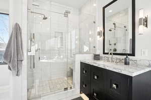 Bathroom with vanity and an enclosed shower