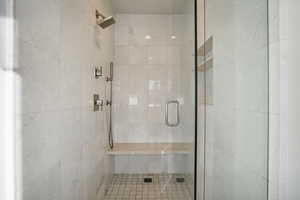 Bathroom with a shower with shower door