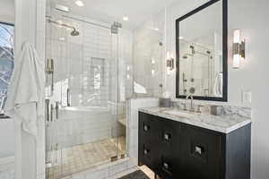 Bathroom with vanity and walk in shower