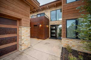 Doorway to property with a balcony