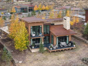 Back of property with an outdoor hangout area