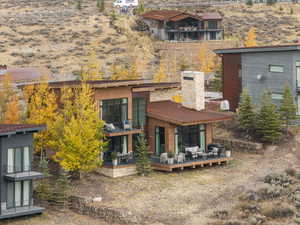 Back of house with a wooden deck