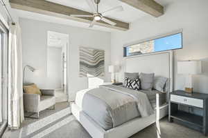 Bedroom with beamed ceiling, ceiling fan, and carpet