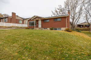 View of front of house with a front yard