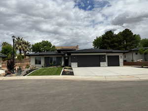 Prairie-style home featuring a garage