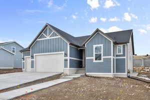 View of front of property featuring a garage