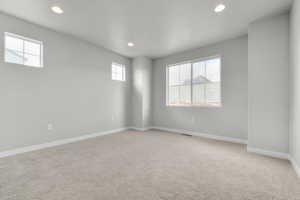 Unfurnished room with carpet flooring