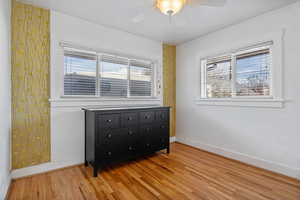 Bedroom featuring light hardwood / wood-style floors and ceiling fan