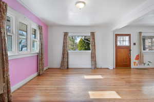 Entryway featuring a healthy amount of sunlight and light hardwood / wood-style floors